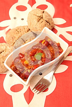 A stew of red beans, meat and corn