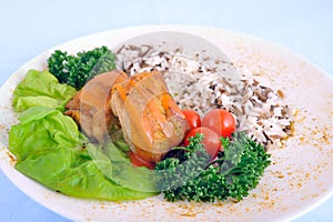 Stew with rice, cherry tomatoes and lettuce