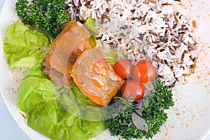 Stew with rice, cherry tomatoes and lettuce