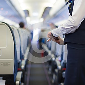 Stewardess on the airplane. photo