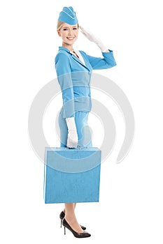Stewardess In Blue Uniform And Suitcase On Whit