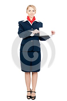 A stewardess holding a sheet of paper