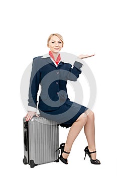 A stewardess holding something