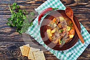 Stewed beef with potato and carrots photo
