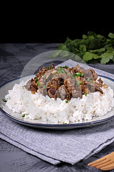 Stewed chicken gizzards on the boiled rice