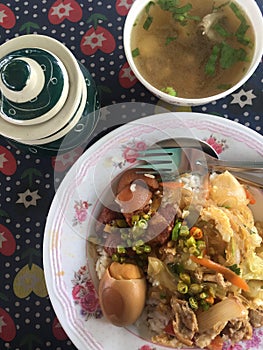 Stewed egg and stir-fried vermicelli on hot streamed rice.