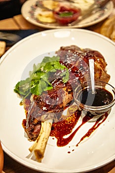 Stewed leg rabbit or duck is on a plate