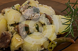 Stewed meat with potatoes with rosemary and chili