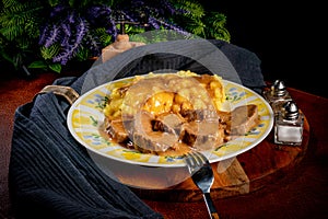 Stewed pork tongues in mustard gravy