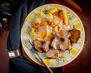 Stewed pork tongues in mustard gravy