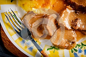 Stewed pork tongues in mustard gravy