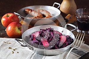 Stewed red cabbage with spices and apples. Garnish for fried sausages