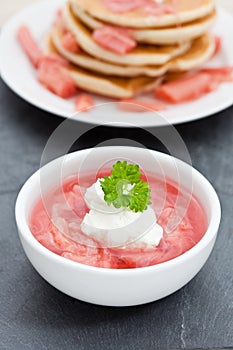 Stewed rhubarb with yogurt in a white dish photo