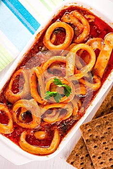 Stewed squid rings with tomato sauce