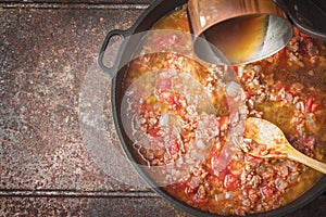 Stewing meat , onion and tomatoes top view
