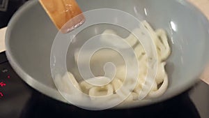Stewing squid in a wok