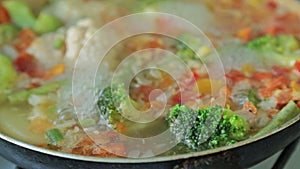 Stewing vegetables in a wok