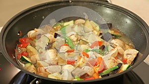 Stewing vegetables in a wok