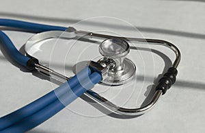 Sthethoscope on medical desk close up. Hospital tool closeup photo