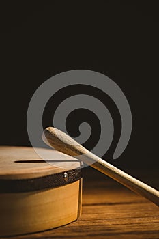 Stick on bodhran over table