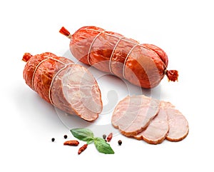 Stick of boiled pork sausage, sliced smoked ham, gammon with spices and fresh herbs isolated on white background