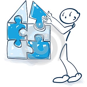 Stick figure builds a house with a puzzle