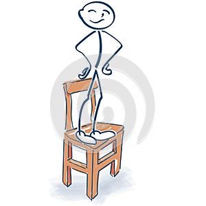 Stick figure stands proudly on the chair