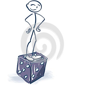 Stick figure stands proudly on a dice