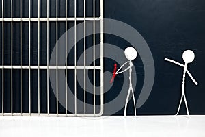 Stick figure victim pointing on a handcuffed suspect man tied with red rope going to a jail prison in dark background.