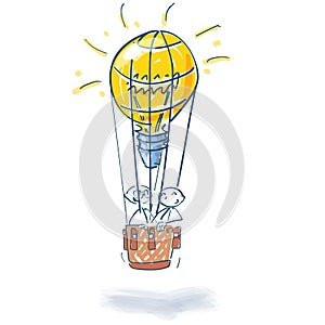 Stick figures in hot air balloon as a light bulb and many ideas