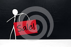 Stick man figure holding red sale and Promotion signage poster. Black Friday concept.