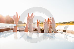 stick out hands from car sunroof happy road trip