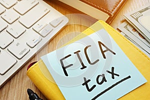 Stick with words fica tax and keyboard. photo