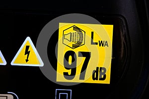 Sticker with 92 decibels warning. Noise pollution and industrial noise levels concepts.