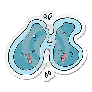 sticker of a cartoon cell dividing