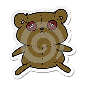 sticker cartoon of a cute stiched up teddy bear