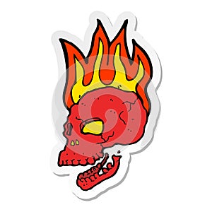 sticker of a cartoon flaming skull