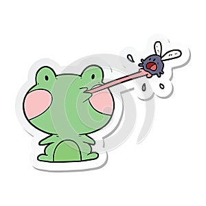 sticker of a cartoon frog catching fly