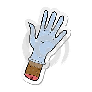 sticker of a cartoon hand with rubber glove