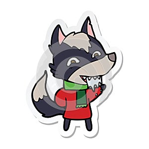 sticker of a cartoon hungry wolf in winter clothes