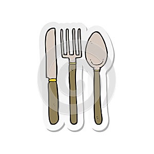 sticker of a cartoon knife fork spoon