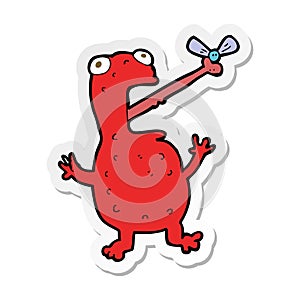 sticker of a cartoon poisonous frog catching fly