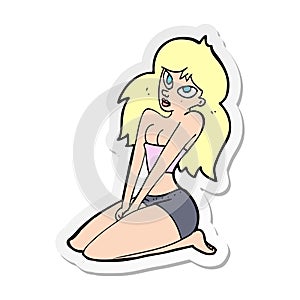 sticker of a cartoon woman in skimpy clothing