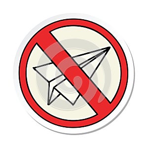 sticker of a cute cartoon no paper aeroplanes allowed