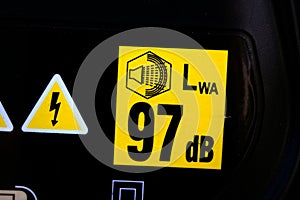 Sticker with 92 decibels warning. Noise pollution and industrial noise levels concepts. photo