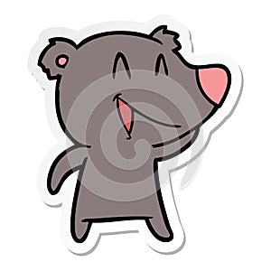 sticker of a laughing bear cartoon