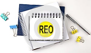 Sticker with REO text on the notebooks on white background photo