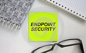 Sticker with text Endpoint security notepad and eyeglasses. Here can be your text