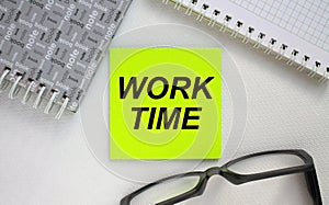 Sticker with text Work Time notepad and eyeglasses. Here can be your text
