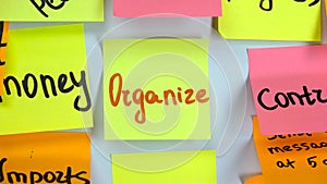 Sticker with the word organize stick on a white board